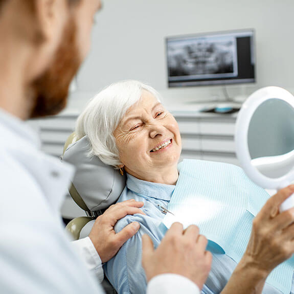 smiling-elderly-woman-with-dentist