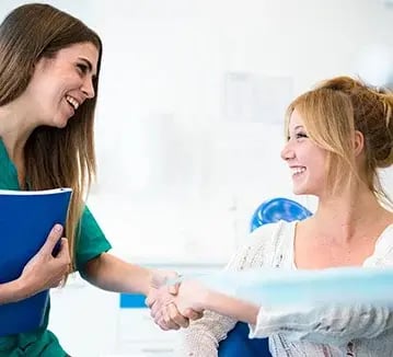 female-patient-meeting-dentist-359x326