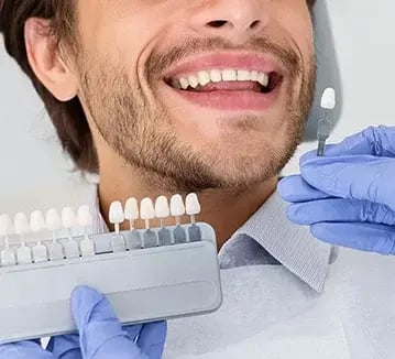 male-getting-teeth-whitened-359x326
